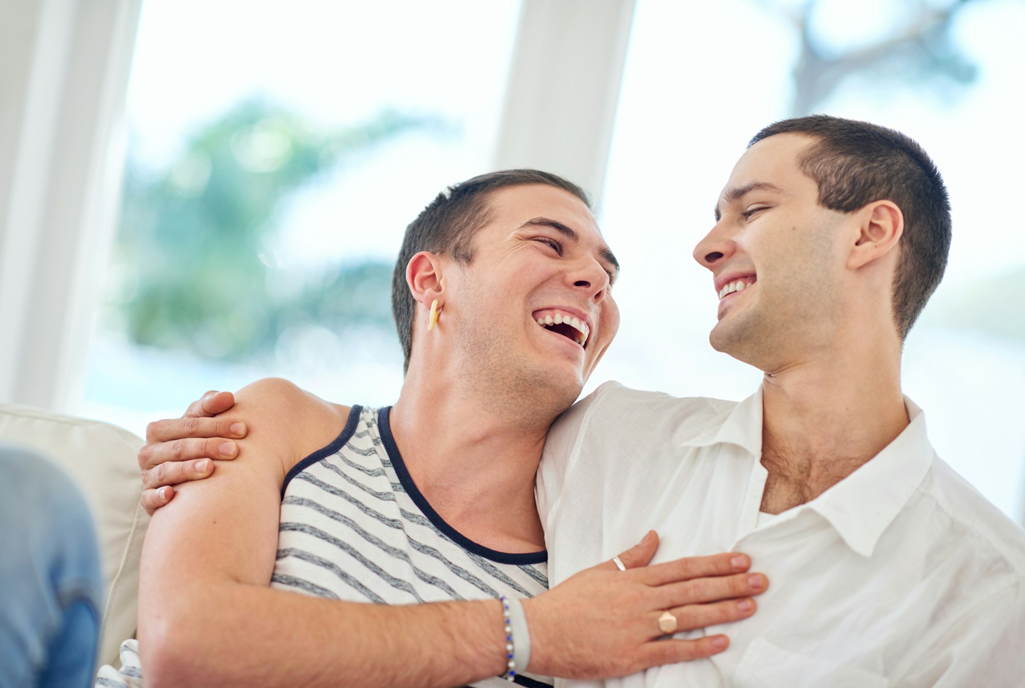 two men hugging each other