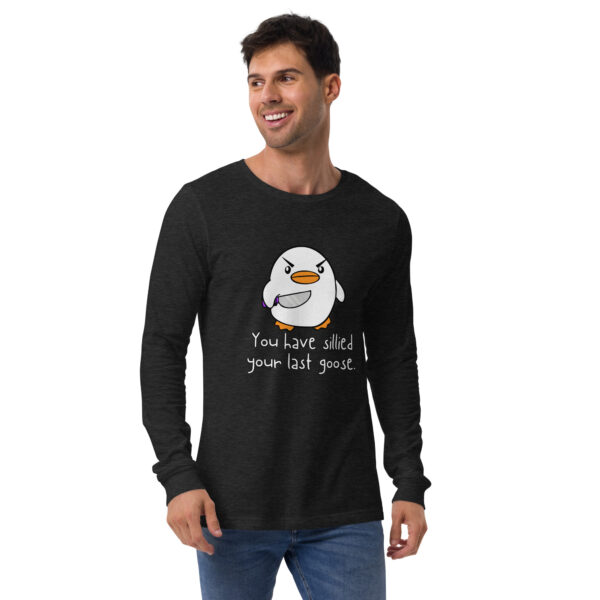 A person wearing the "You Have Sillied Your Last Goose LS," a black long-sleeve shirt featuring a cartoon penguin and text.