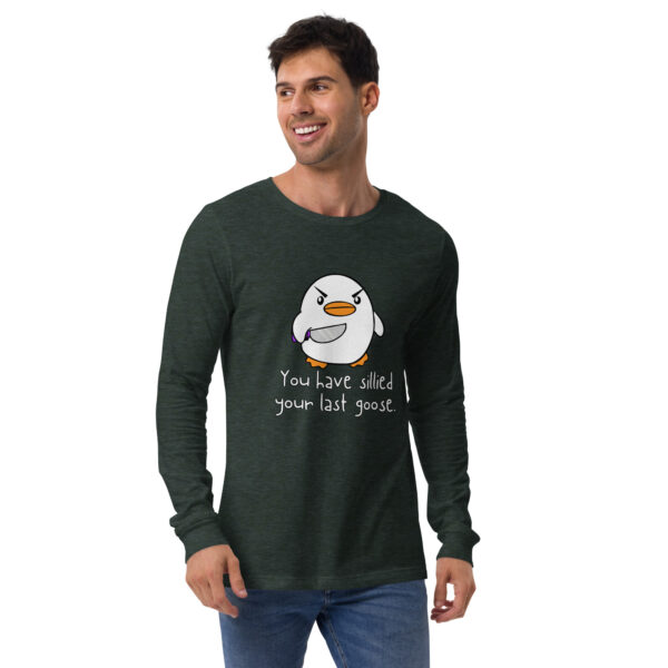 A person wearing a dark green long-sleeve shirt with a cartoon penguin and the text "You Have Sillied Your Last Goose.