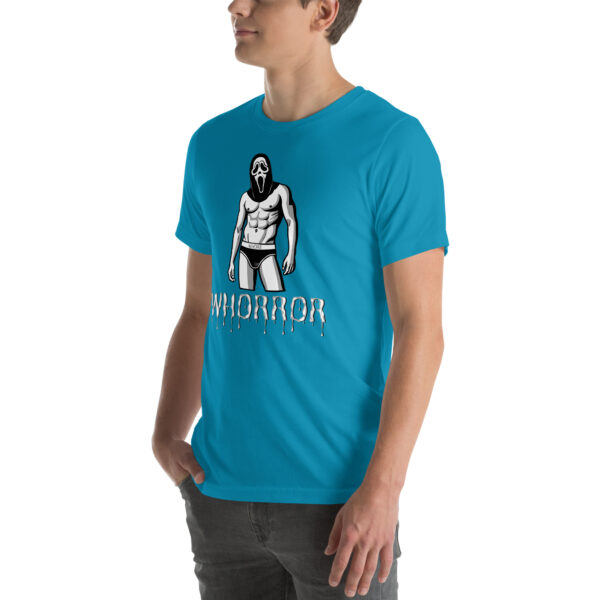 A person wearing a blue t-shirt featuring the "Whorror" graphic of a masked figure, with the word "HORROR" in dripping letters, paired with dark pants.