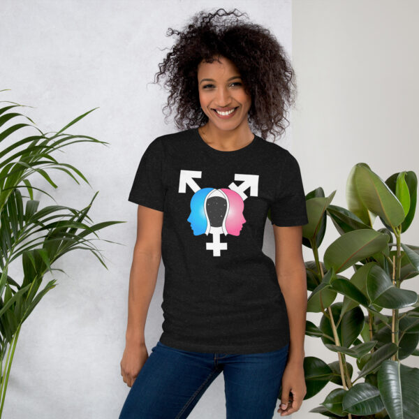 Person wearing the "Beyond the Binary" black T-shirt, adorned with a gender symbols design, standing next to indoor plants.