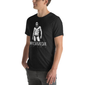 A person wearing a black Whorror T-shirt, featuring a graphic of a muscular figure in a mask with the text "WHORROR.