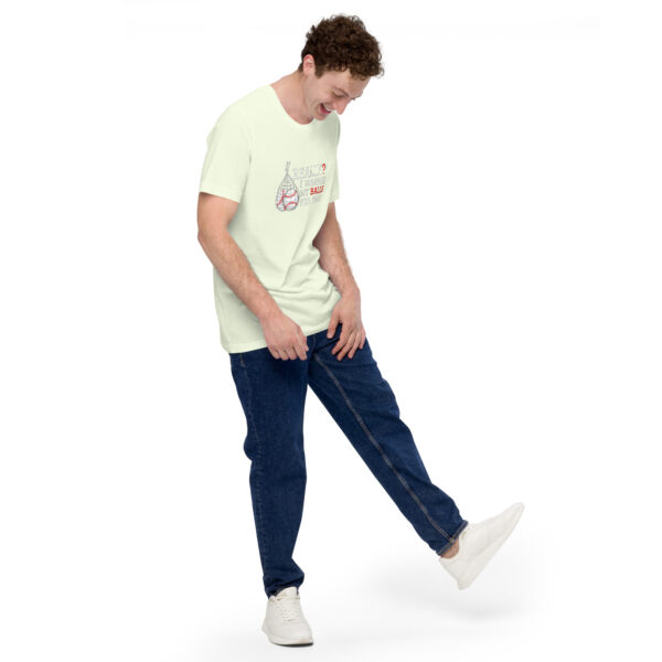 A man wearing a "Really?! I washed my balls for this!" light green graphic t-shirt and blue jeans smiles as he poses with one foot slightly raised against a plain white background.