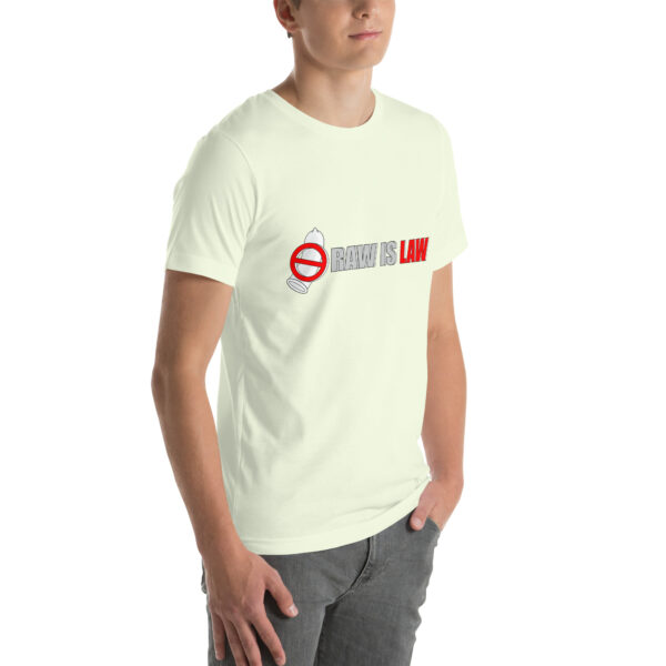 An individual dressed in a light-colored unisex t-shirt featuring the phrase "RAW IS LAW" along with a design that combines a yin-yang symbol with a stop sign.