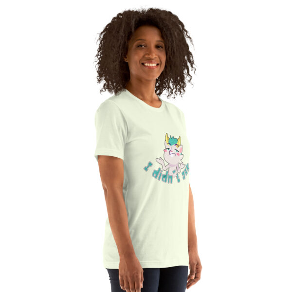 A person with curly hair is wearing a light-colored T-shirt showcasing a cartoon cat, accompanied by the product name "I Didn't Ask".