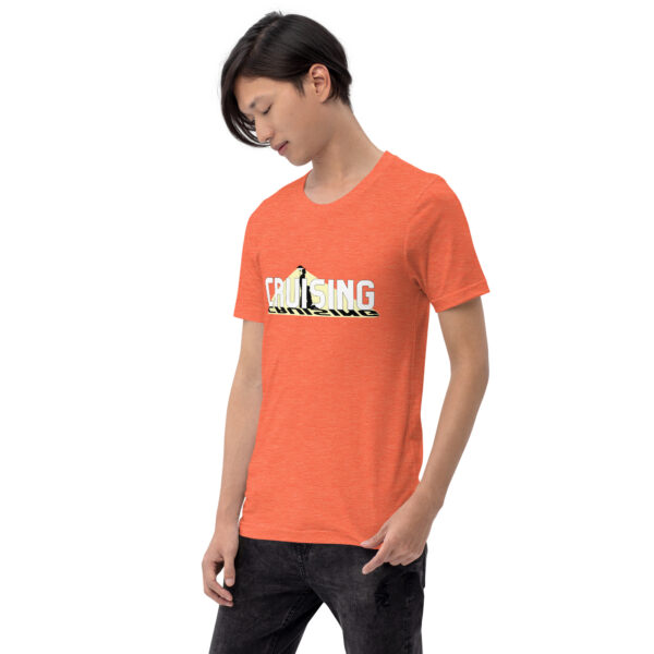 A person wearing the "Cruising" orange t-shirt featuring the word and a graphic is set against a plain white background.