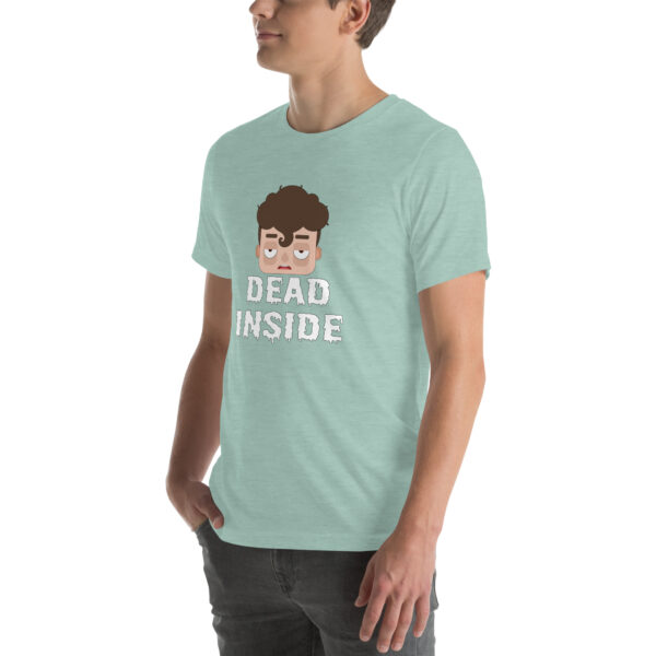 An individual wearing a light green t-shirt featuring the product "Dead Inside," which includes a cartoon face and the phrase printed on it.