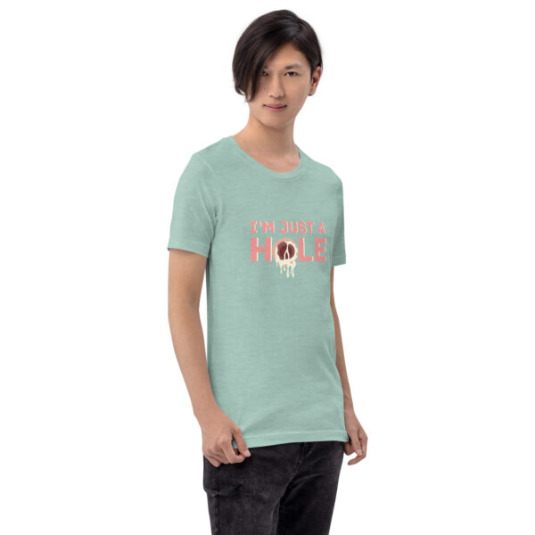 A person is dressed in a shirt featuring the "I'm Just a Hole" design, which includes a light green color and a dripping graphic.