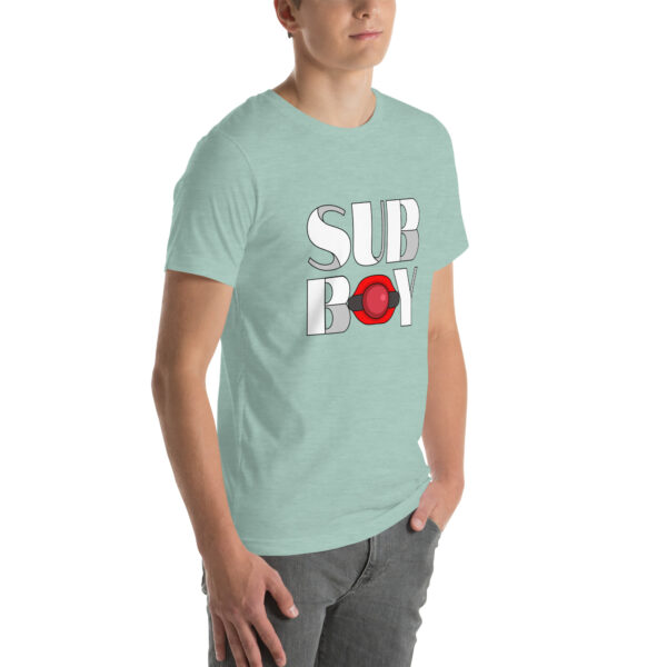 A person wearing "Sub Boy," a light green t-shirt featuring "SUB BOY" and a red ring graphic, paired with gray pants.