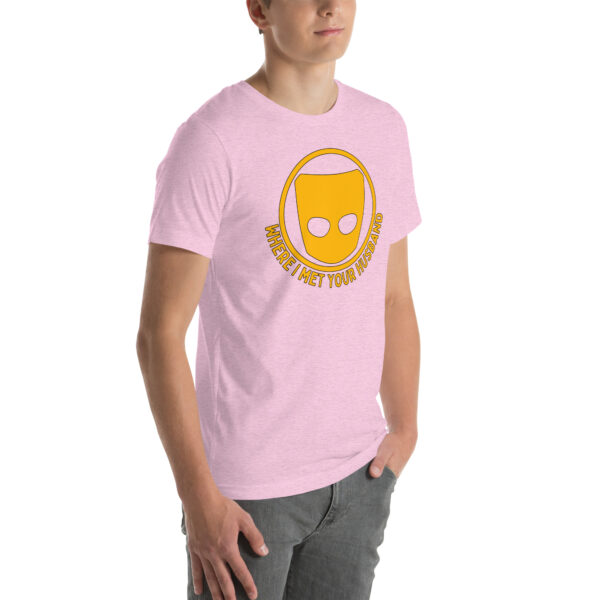 The individual is sporting a pink t-shirt featuring a graphic of a yellow cartoon cheese head, accompanied by the text "WHERE I MET YOUR HUSBAND" on the front.