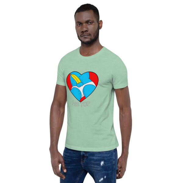 A man wearing "His Top," a green t-shirt featuring a heart graphic, stands against a plain background.