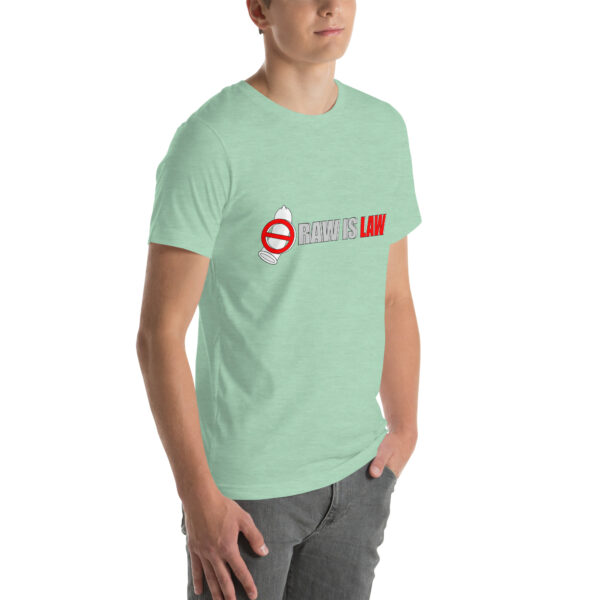 A person is wearing a light green Unisex t-shirt with "RAW IS LAW" and a red prohibited symbol printed on it.