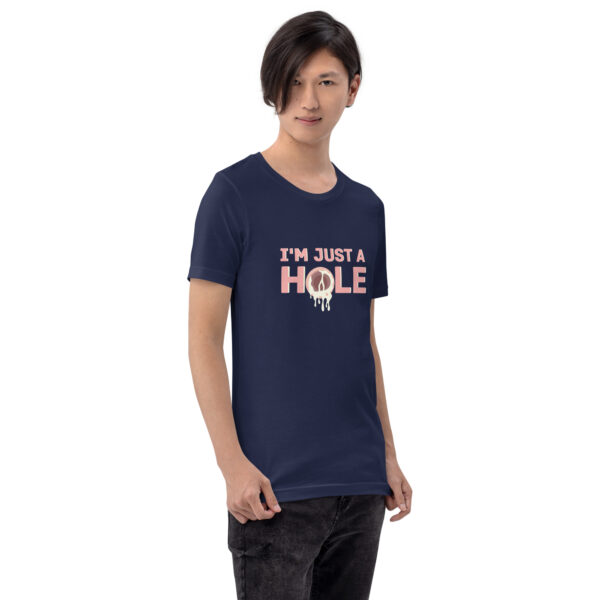 A person wearing the "I'm Just a Hole" navy T-shirt featuring text with a dripping effect design stands against a plain backdrop.