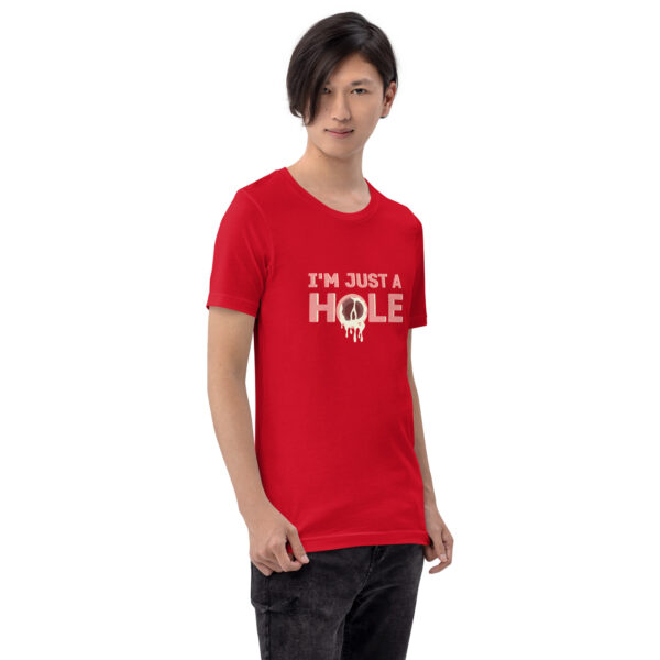 A person wearing the "I'm Just a Hole" red t-shirt with a graphic of a donut.