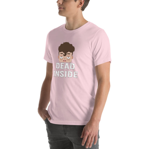 An individual is wearing a light pink t-shirt featuring the product name "Dead Inside," adorned with a cartoon face on the front.