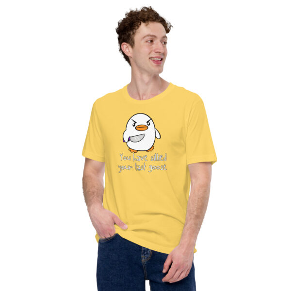 A person wearing a yellow t-shirt featuring an irate cartoon bird along with the text "You Have Sillied Your Last Goose," glancing sideways with a smile.