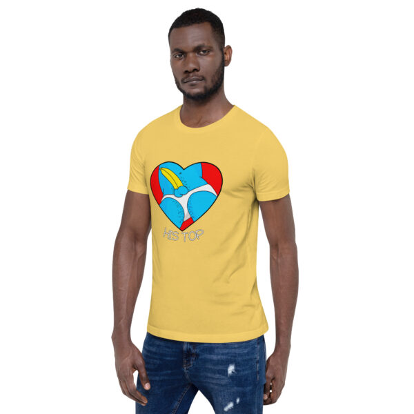 A man dressed in ripped jeans and a yellow t-shirt featuring the "His Top" design with a heart graphic.