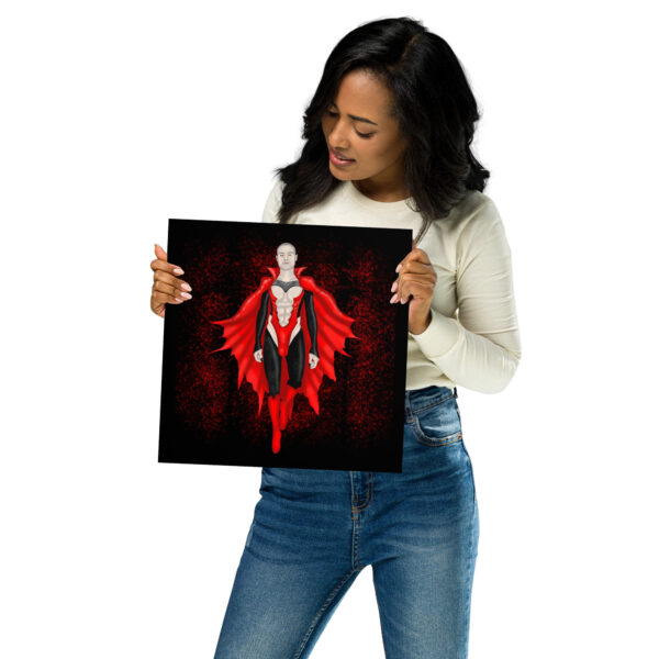 A woman wearing a white top and jeans holds a square print titled "Count Matthew Clyde," featuring a superhero with a red cape on a black background.