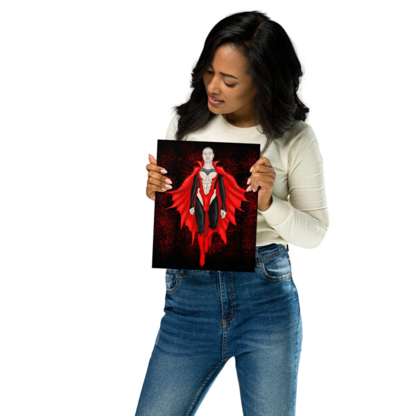 Person holding and looking at an artwork of Count Matthew Clyde, a superhero in a red cape on a white background.