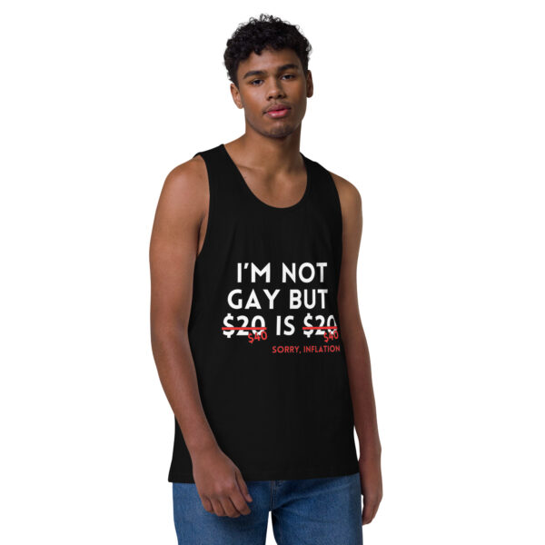 A person wearing the "I'm Not Gay" tank, a black top featuring white and red text that reads, "I'm not gay but $20 is $20, sorry, inflation.