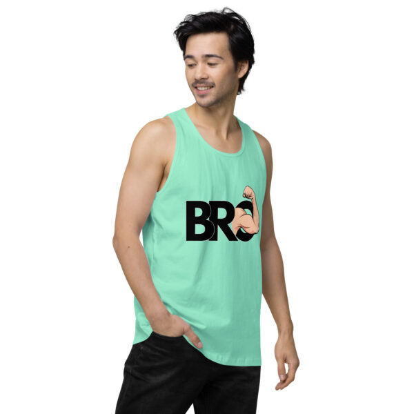 A person wearing the "Bro Tank" in mint green, featuring the word "BRO" and a flexed arm graphic, looking to the side.