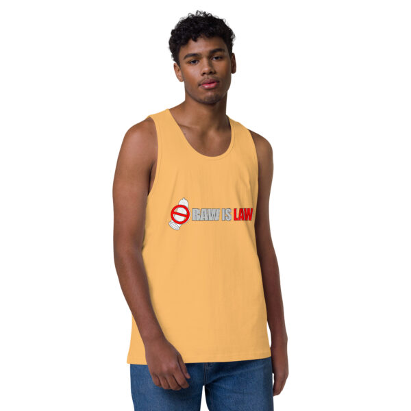 A man wearing the Raw is Law Tank, featuring a yellow design with "RAW IS LAW" printed in red and white, stands against a plain white background.