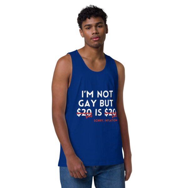 A person is wearing the "I'm Not Gay Tank," a blue top featuring white and red text that reads: "I’m not gay but $20 is $20, sorry, inflation.