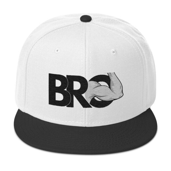 White cap with a black brim featuring the "Bro Hat" design that includes a flexed arm graphic intertwined with the letters "BRO.