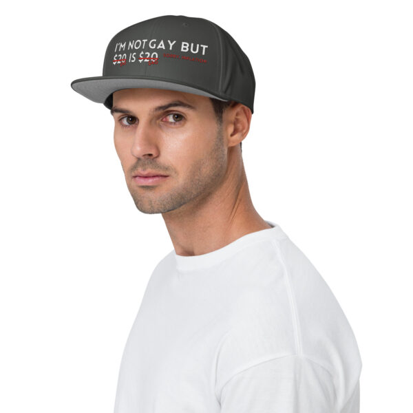 A person wearing the "I'm Not Gay" snapback hat with white and red text stands against a plain background.