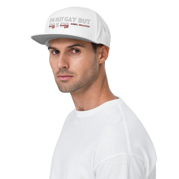 A person is wearing the "I'm Not Gay Snapback Hat," paired with a white shirt, set against a plain background.