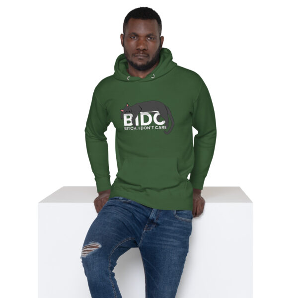 A person wearing the BIDC Hoodie with a cat graphic and text, standing against a white background.