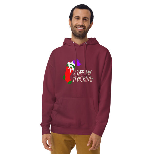 A man stands and smiles while wearing a maroon unisex hoodie featuring a colorful stocking graphic and the phrase "STUFF MY STOCKING.