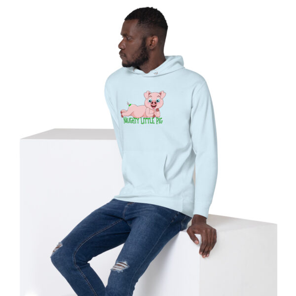 A man is seated on a white cube, dressed in the Naughty Little Pig Hoodie—a light blue hoodie featuring a cartoon pig and the words "Naughty Little Pig.