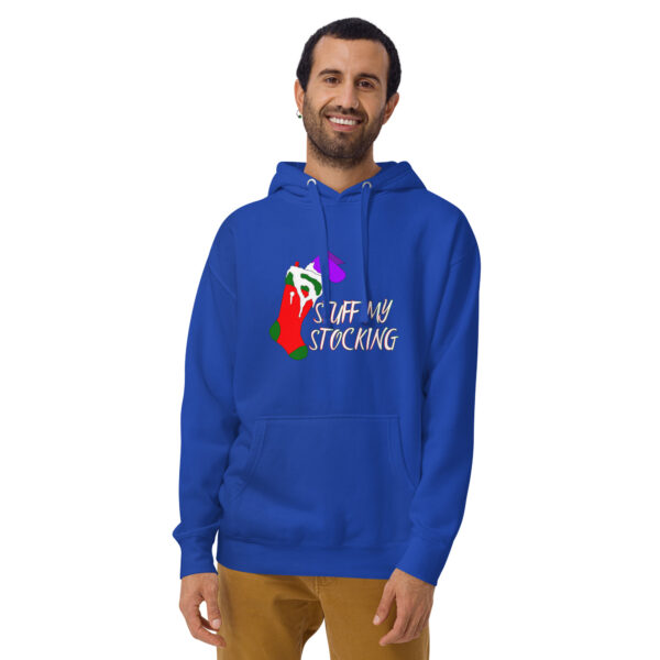 A person wearing a Unisex Hoodie featuring a colorful stocking graphic and the text "STUFF MY STOCKING" stands against a plain background.