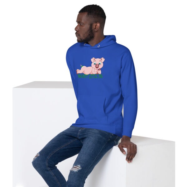 A man wearing a Naughty Little Pig Hoodie sits on a white block, looking to the side.