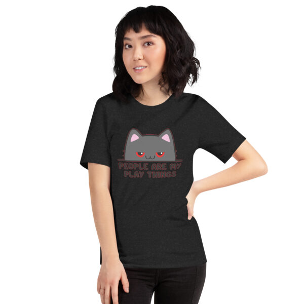 A person wearing a black T-shirt featuring the cartoon cat face and text design from the "People Are My Play Things" product line.