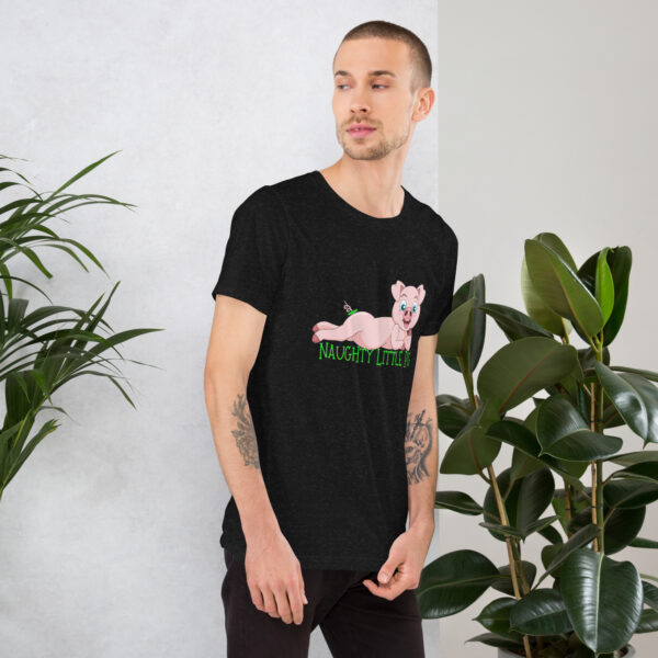 Man wearing a black t-shirt featuring the "Naughty Little Pig" design, standing next to potted plants.