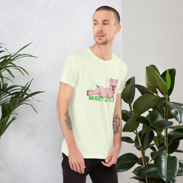 A man in a light green shirt featuring the "Naughty Little Pig" design stands beside indoor plants.