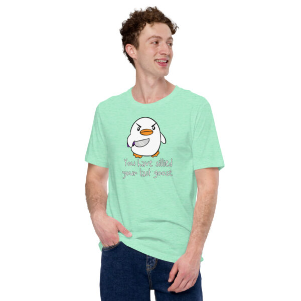 Donning a light green t-shirt emblazoned with a cartoon bird and bold text, "You Have Sillied Your Last Goose," a person strides with confidence as if making their statement clear.