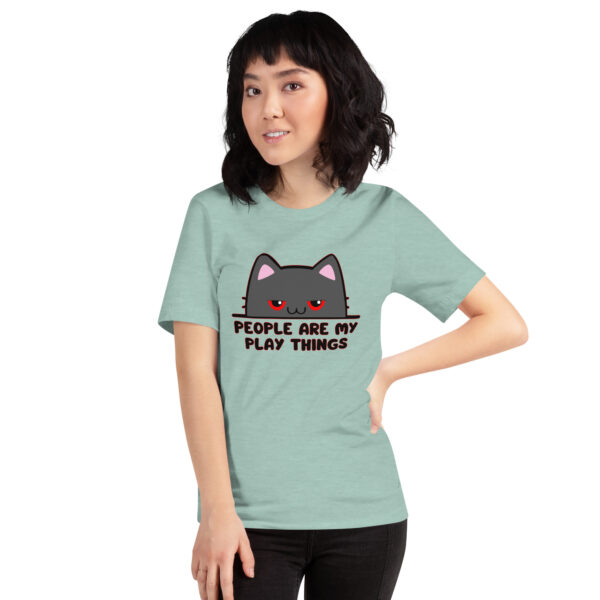 Person wearing a light green t-shirt featuring the "People Are My Play Things" design with a cat graphic.