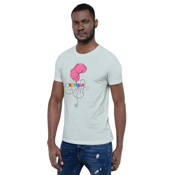 Man wearing the "It's My Birthday" light green T-shirt featuring a pink balloon and text design, paired with distressed blue jeans.