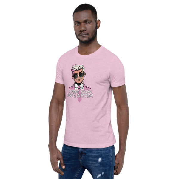 A man confidently stands against a plain white background, wearing a pink t-shirt with a cartoon character and the playful text, "I Made Your Dad A Bottom," referencing the product name.