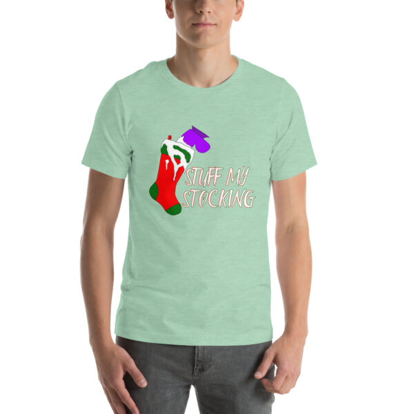 A person dressed in a green t-shirt featuring a stocking design and the phrase "Stuff My Stocking.