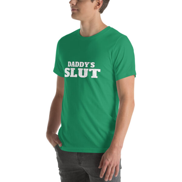 Individual dressed in a green T-shirt displaying the text "Daddy's Slut" in white.