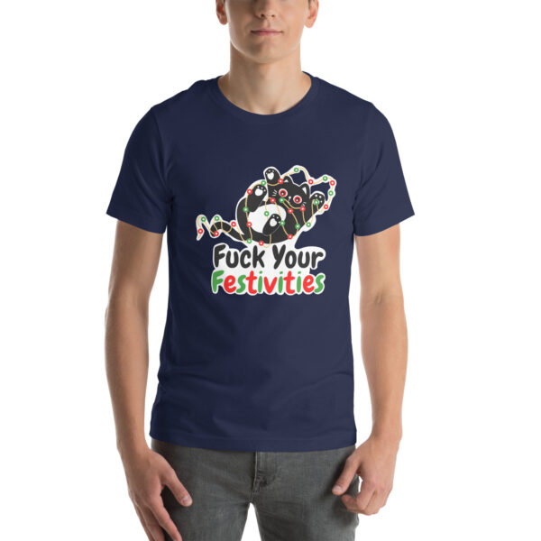 A person wearing a "Fuck Your Festivities" navy T-shirt featuring a colorful abstract design.