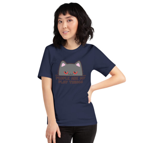 A person wearing the "People Are My Play Things" navy blue T-shirt featuring a cartoon cat.