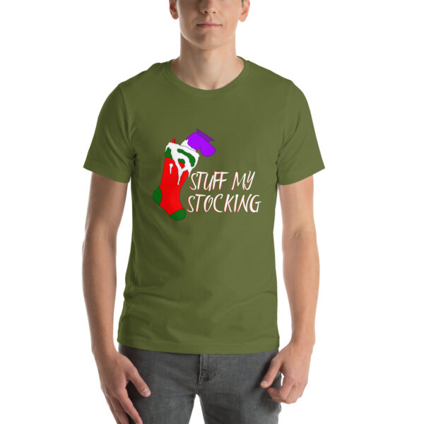 A person wearing the "Stuff My Stocking" green t-shirt featuring a stocking graphic and the text "STUFF MY STOCKING.