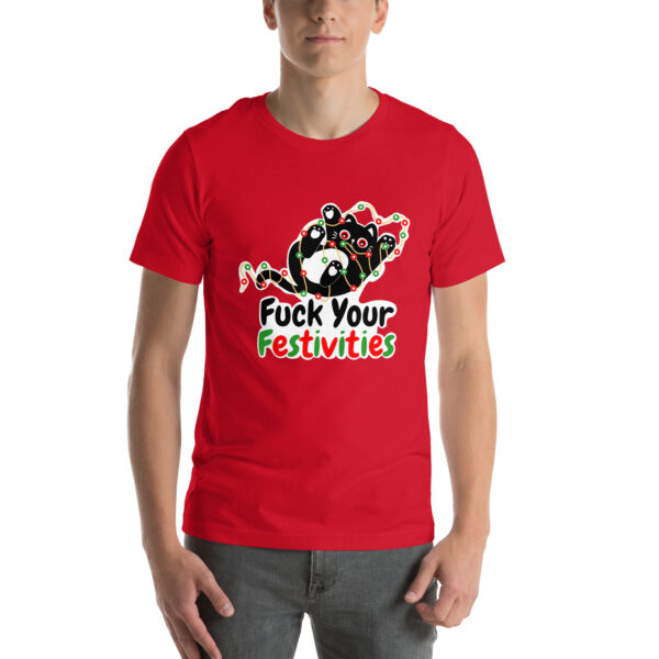 A person dressed in a red T-shirt featuring the "Fuck Your Festivities" product with a playful cartoon graphic.