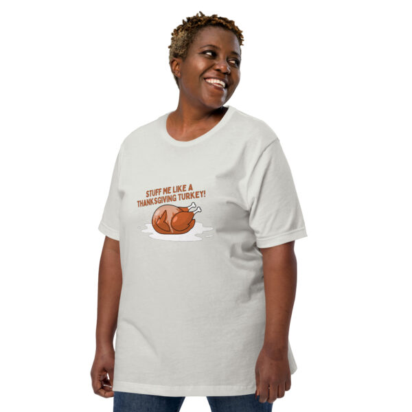 Person wearing a "Stuff Me" T-shirt featuring a turkey graphic and the text "STUFF ME LIKE A THANKSGIVING TURKEY!" on a white background.