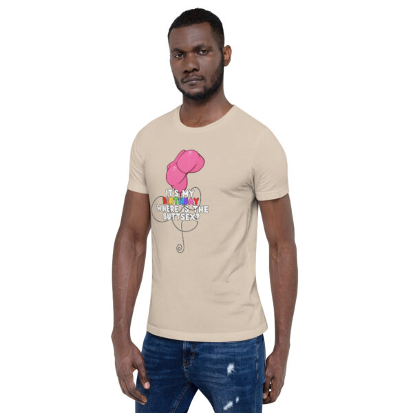 A man in a beige "It's My Birthday" T-shirt with a pink flower and text graphic.